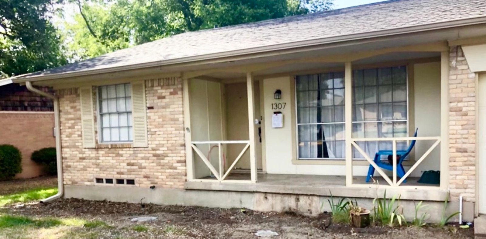 Dated tan brick ranch house before renovation