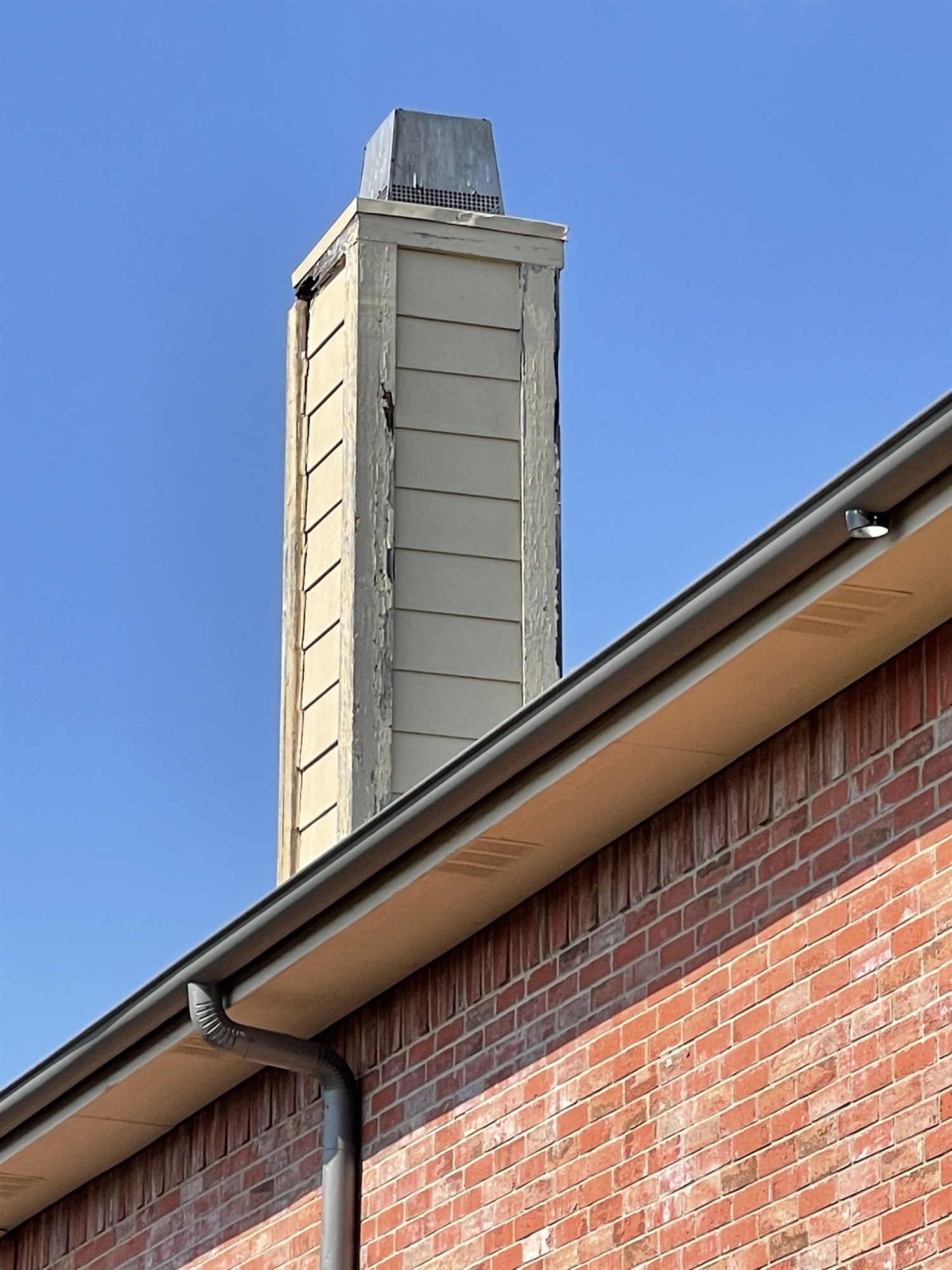 Chimney siding replacement in progress
